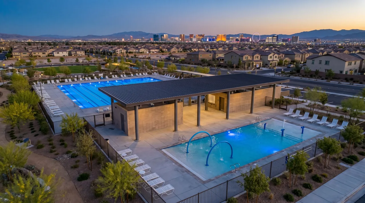 Cadence Henderson Central Park community pool with the Las Vegas Strip skyline visible in the background
