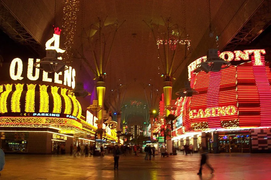 Fremont Street Experience neon canopy at night with crowds walking below in downtown Las Vegas
