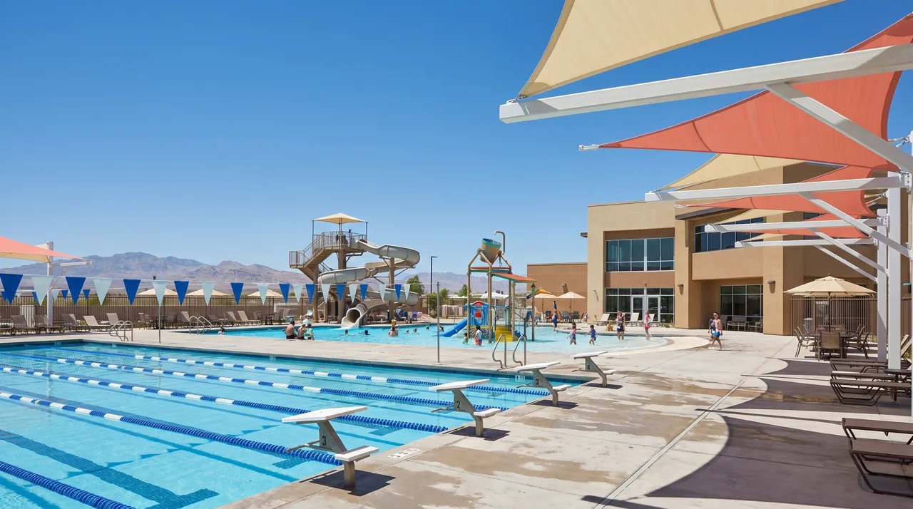 Henderson Multigenerational Center exterior with swimmers in the outdoor aquatic complex