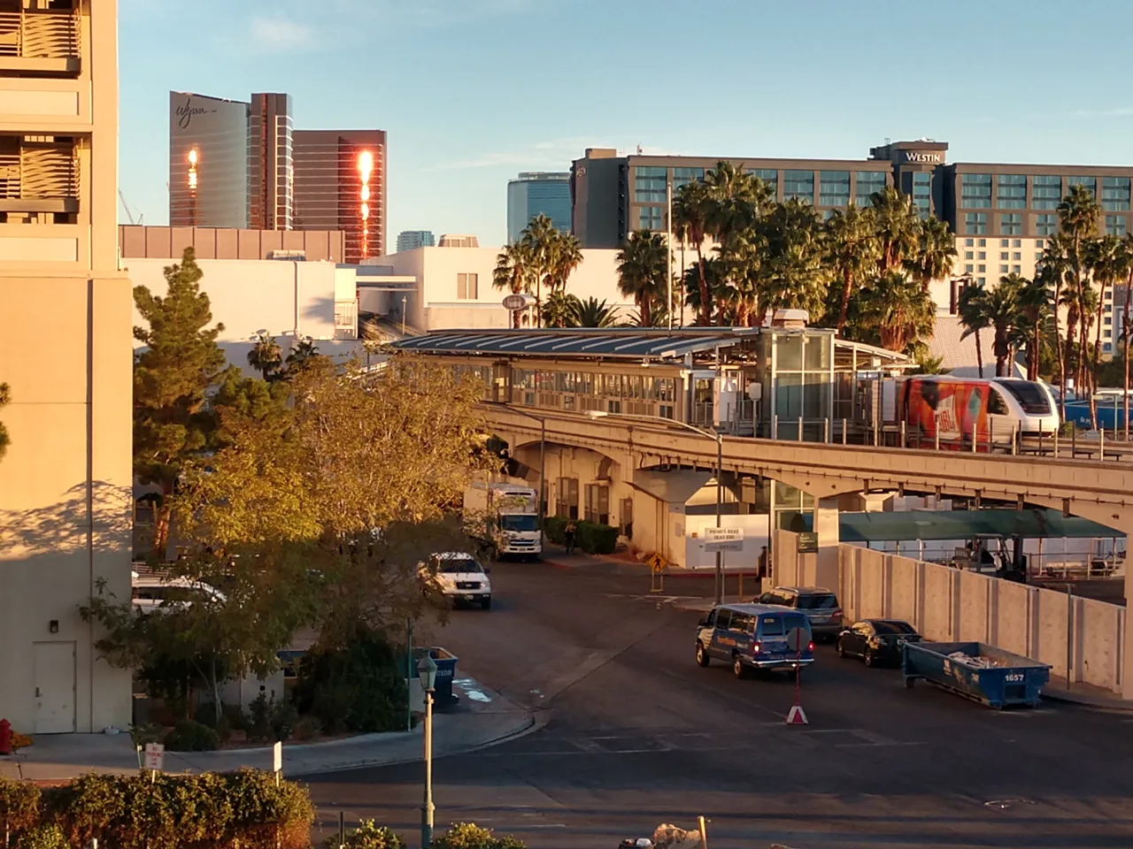 Las Vegas Monorail train arriving at an elevated station with Strip resort towers in the background