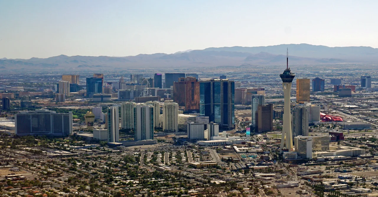 Las Vegas Strip skyline at dusk with desert mountains in the background