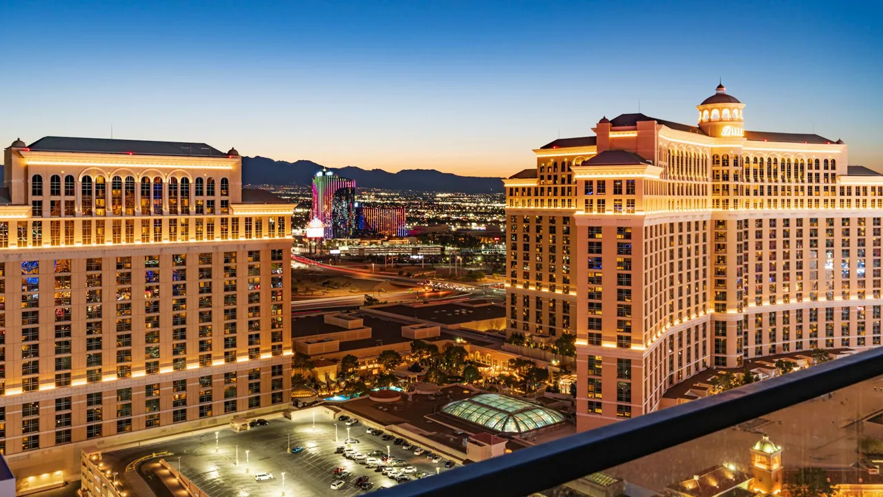 Las Vegas Strip skyline at golden hour with the resort corridor extending toward the mountains