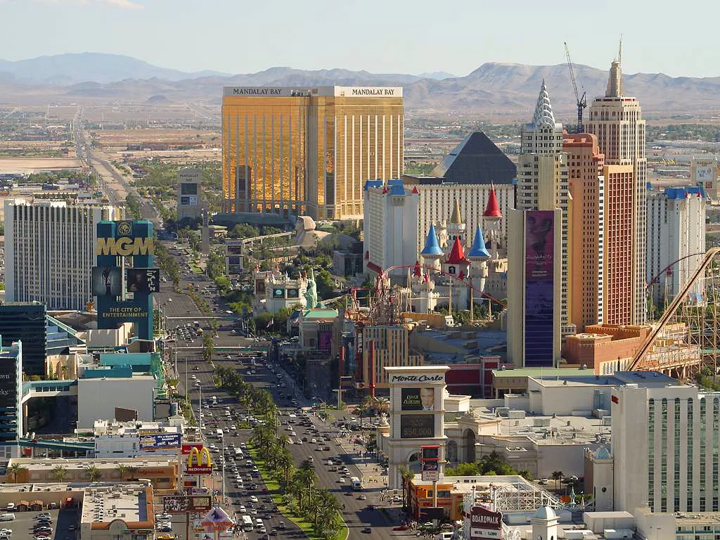 Las Vegas Strip skyline at sunset with desert mountains in the background