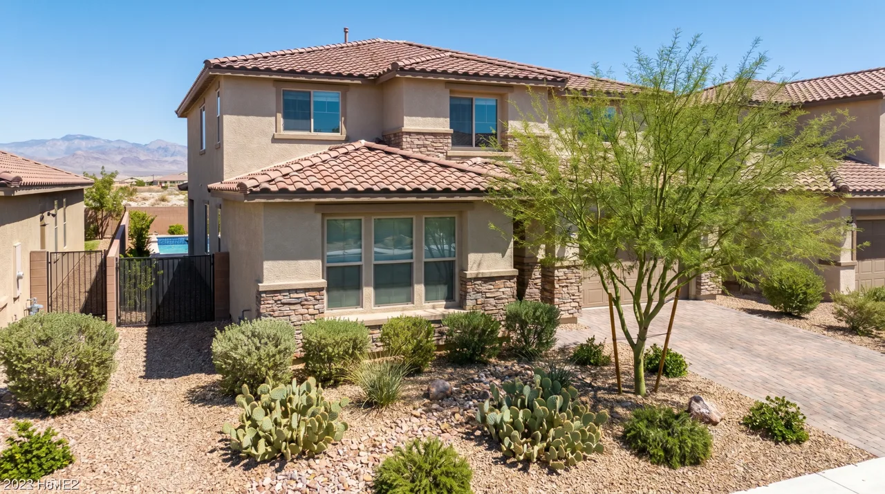 Modern single-family home in a Las Vegas suburb with desert landscaping and a backyard pool