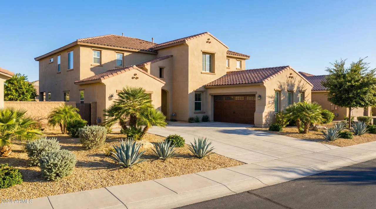 Modern two-story stucco home with desert landscaping and two-car garage in a Las Vegas suburb