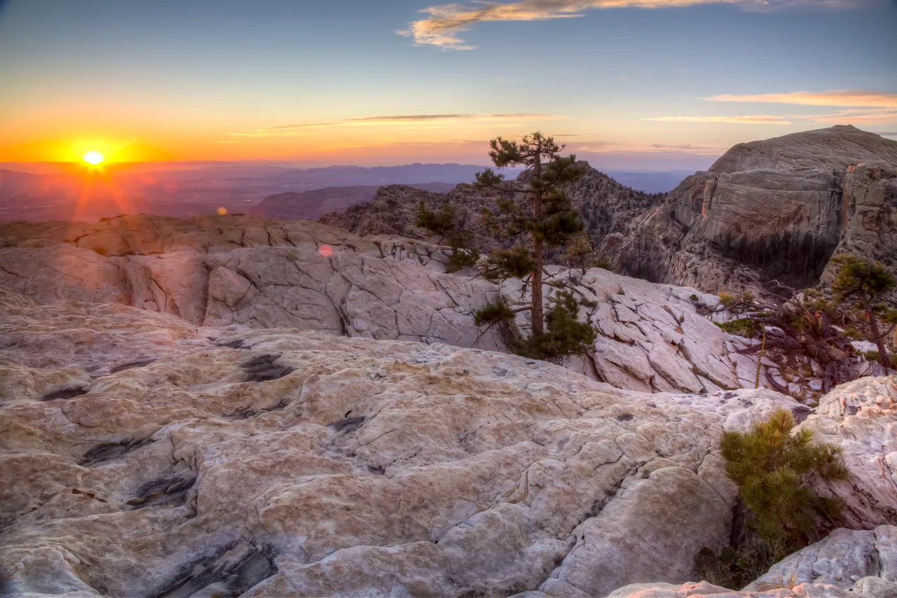 An empty desert trail at sunrise with red sandstone formations at Red Rock Canyon near Las Vegas