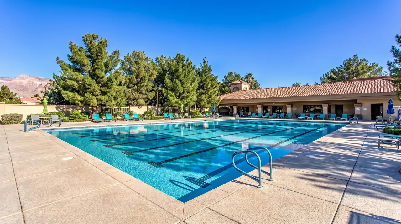 Sun City Summerlin clubhouse and pool deck with desert landscaping in Las Vegas